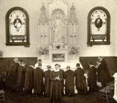 Black and white photo of men praying