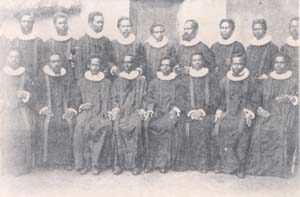 Class of Malagasy pastors in Norwegian style robe and ruff. ca. 1910