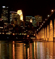 Downtown Minneapolis at night along the Stone Arch Bridge