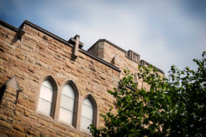 side of campus building against blue sky