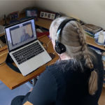 Mary Hess in front of a computer on a video call