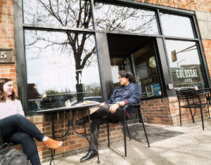 Recent M.Div. graduates Sarah Fike (left) and David Rojas Martinez talk at Colossal Cafe in St. Paul, Minnesota, near Luther Seminary's campus