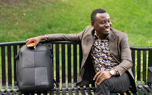 Person sitting on a bench at Luther Seminary