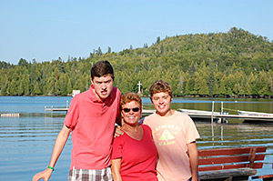 group posing by lake