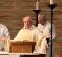 Seminary Pastor John Mann (left) leads chapel service