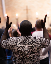 Luther Seminary Student raised his hands in worship