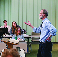 Professor Craig Koester '80 M.Div. addresses an attentive classroom.