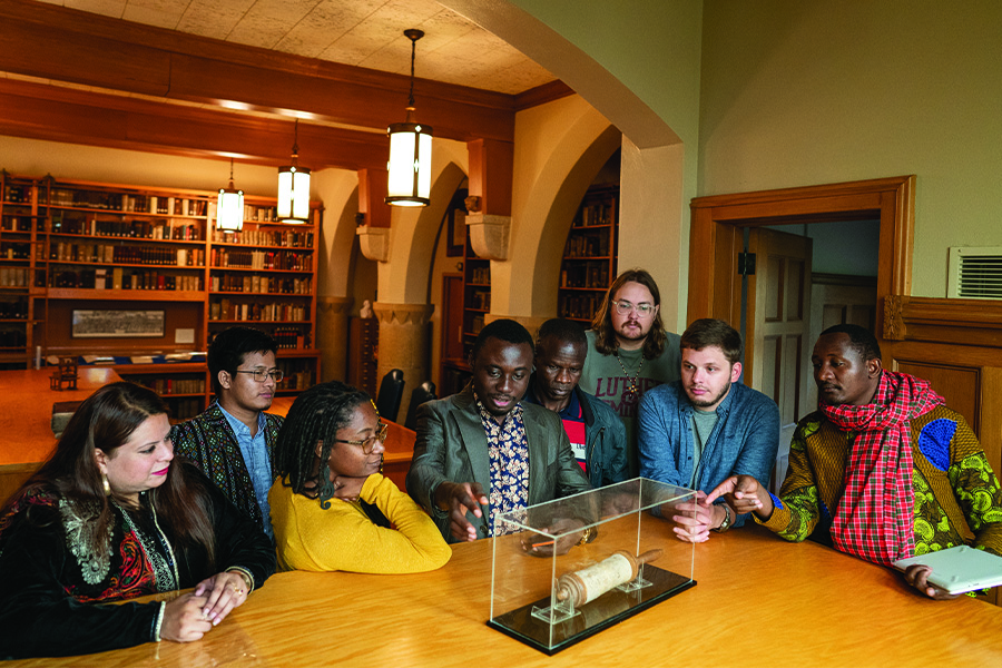 Students looking at the Esther Scroll in the Rare Book Room