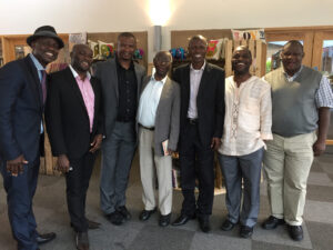 Kwiyani with John Mbiti (third and fourth from left), a Kenyan Christian philosopher and writer, and students in Oxford, England (courtesy photo)